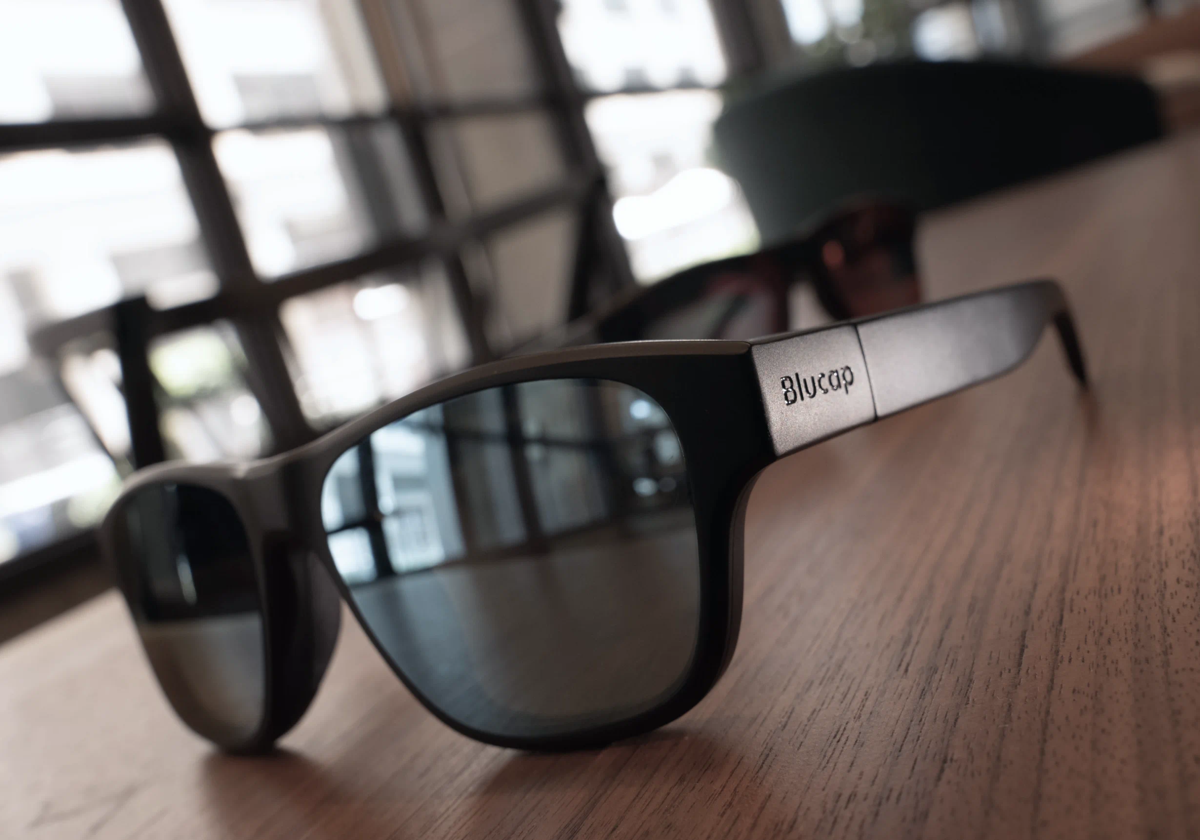 a close up of blucap glasses on a table